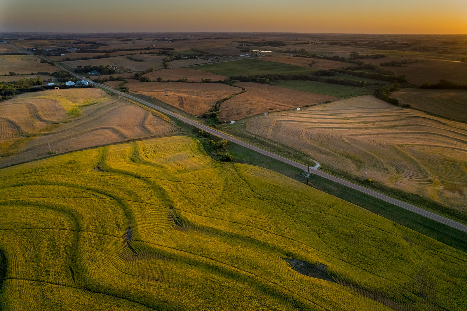 Aerial photo of farmland at sunset.