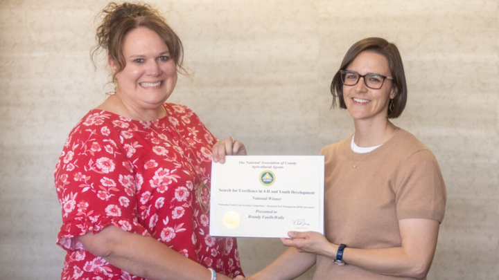Brandy VanDeWalle (left) accepting a 4H award.